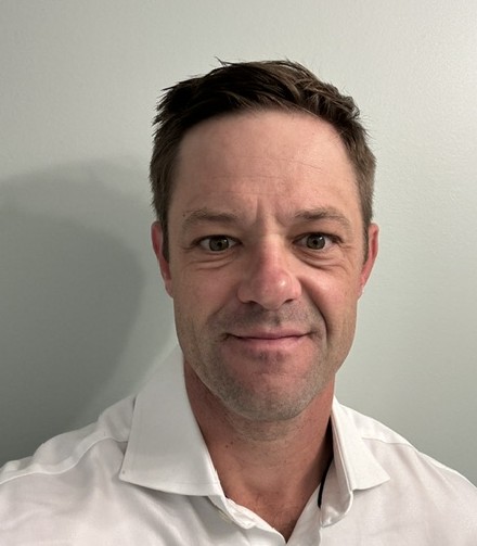 Joe Vardon in a white collared shirt